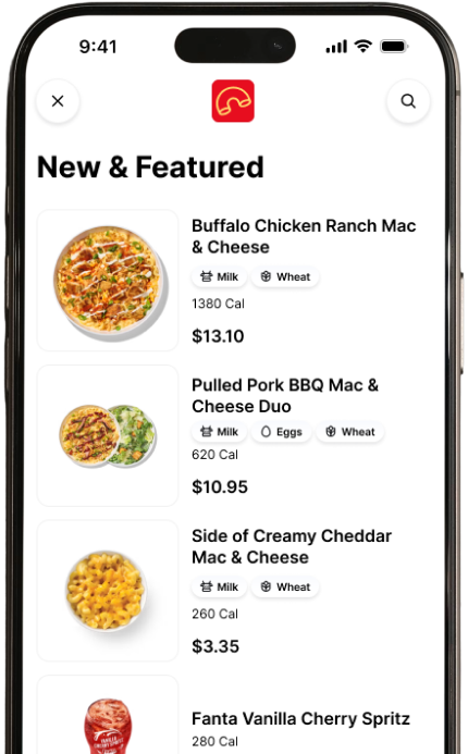 Mobile food-ordering app screen showing a “New & Featured” menu with mac and cheese dishes, prices, calories, and a Fanta drink.