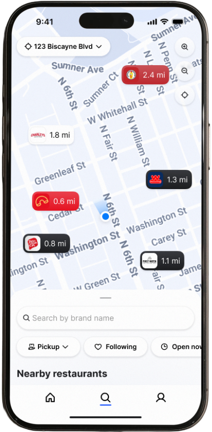 A smartphone displays a restaurant-finder map near 123 Biscayne Blvd, with nearby eateries marked by red and black distance labels and search controls.